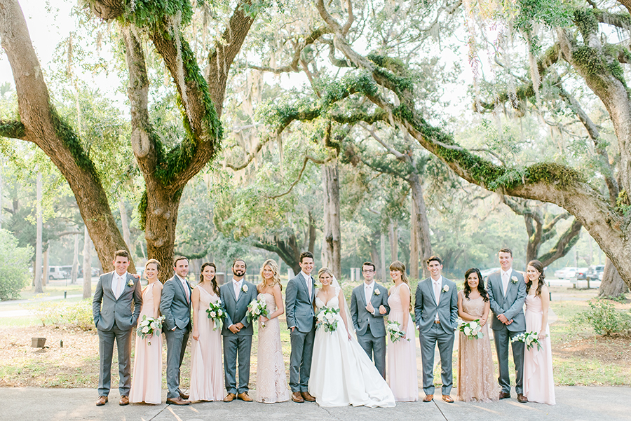 Bridal party posing in front of The Ribault Club