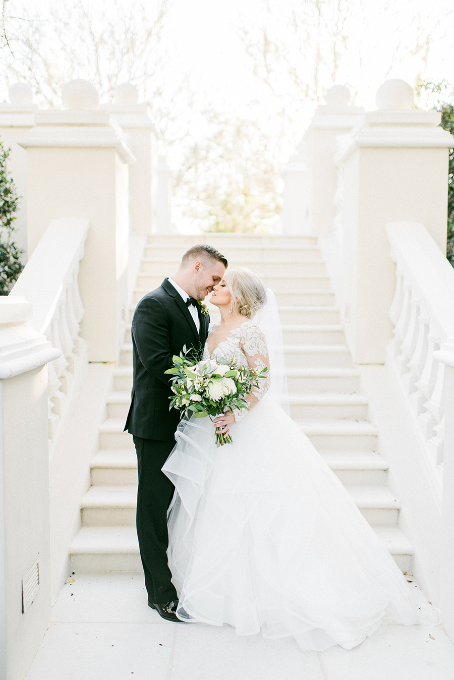 Couple in front of stairs