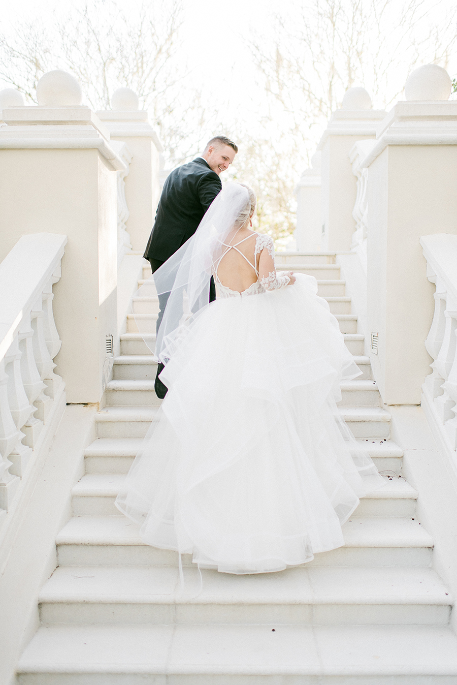 bride and groom at staircase