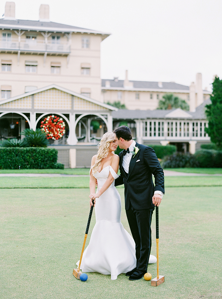 bride and groom playing croquet